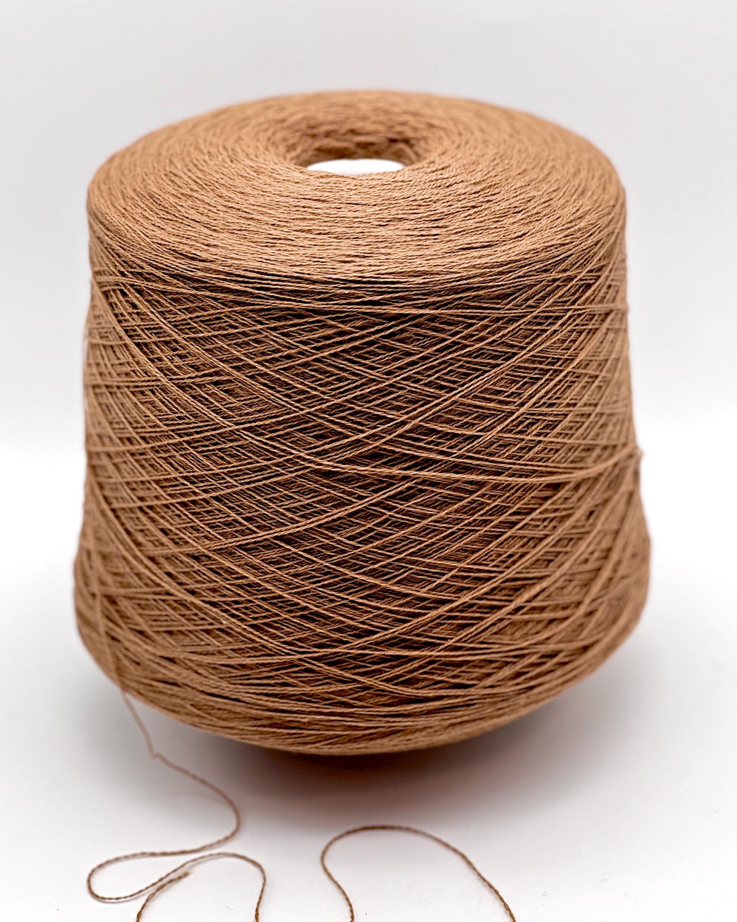 Exclusive iDOKNiT lace weight yarn, VIGOGNA by RiGo Italy. A high-quality blend of 10% cashmere and 90% merino wool in a 2/23 count, providing 1150m per 100g. Curated by iDOKNiT in 1276 Pink and 1277 Camel. Authentic Italian-made luxury fiber for ultra-soft, delicate garments with a refined finish.