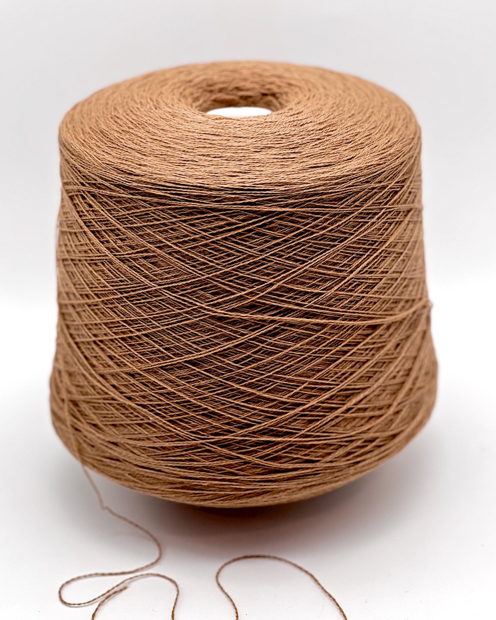 Exclusive iDOKNiT lace weight yarn, VIGOGNA by RiGo Italy. A high-quality blend of 10% cashmere and 90% merino wool in a 2/23 count, providing 1150m per 100g. Curated by iDOKNiT in 1276 Pink and 1277 Camel. Authentic Italian-made luxury fiber for ultra-soft, delicate garments with a refined finish.