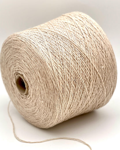 Beige yarn spool on a white background