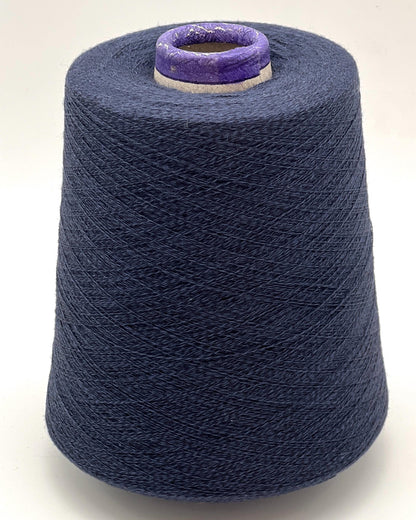 Spool of blue yarn on a white background