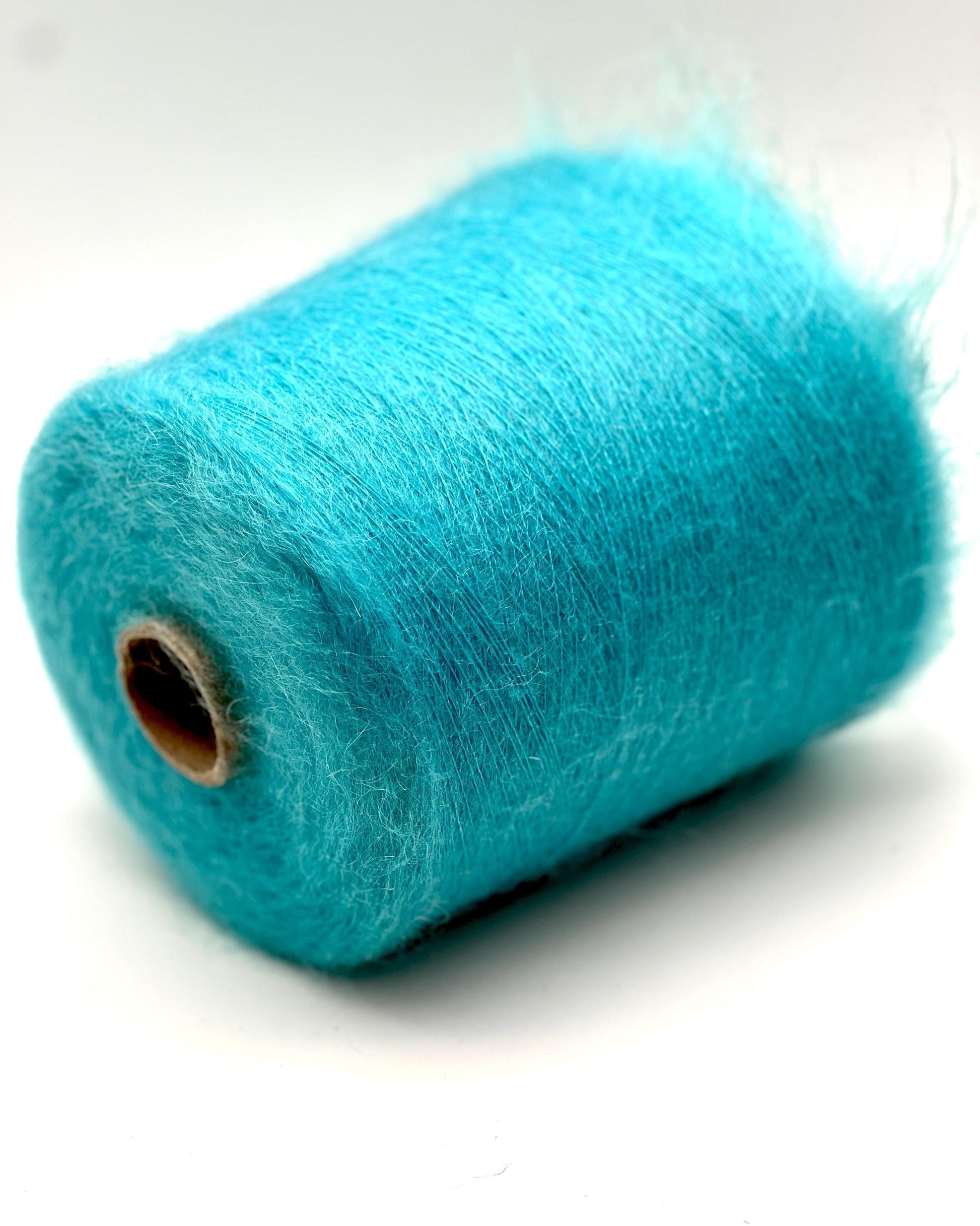 Turquoise yarn on a white background