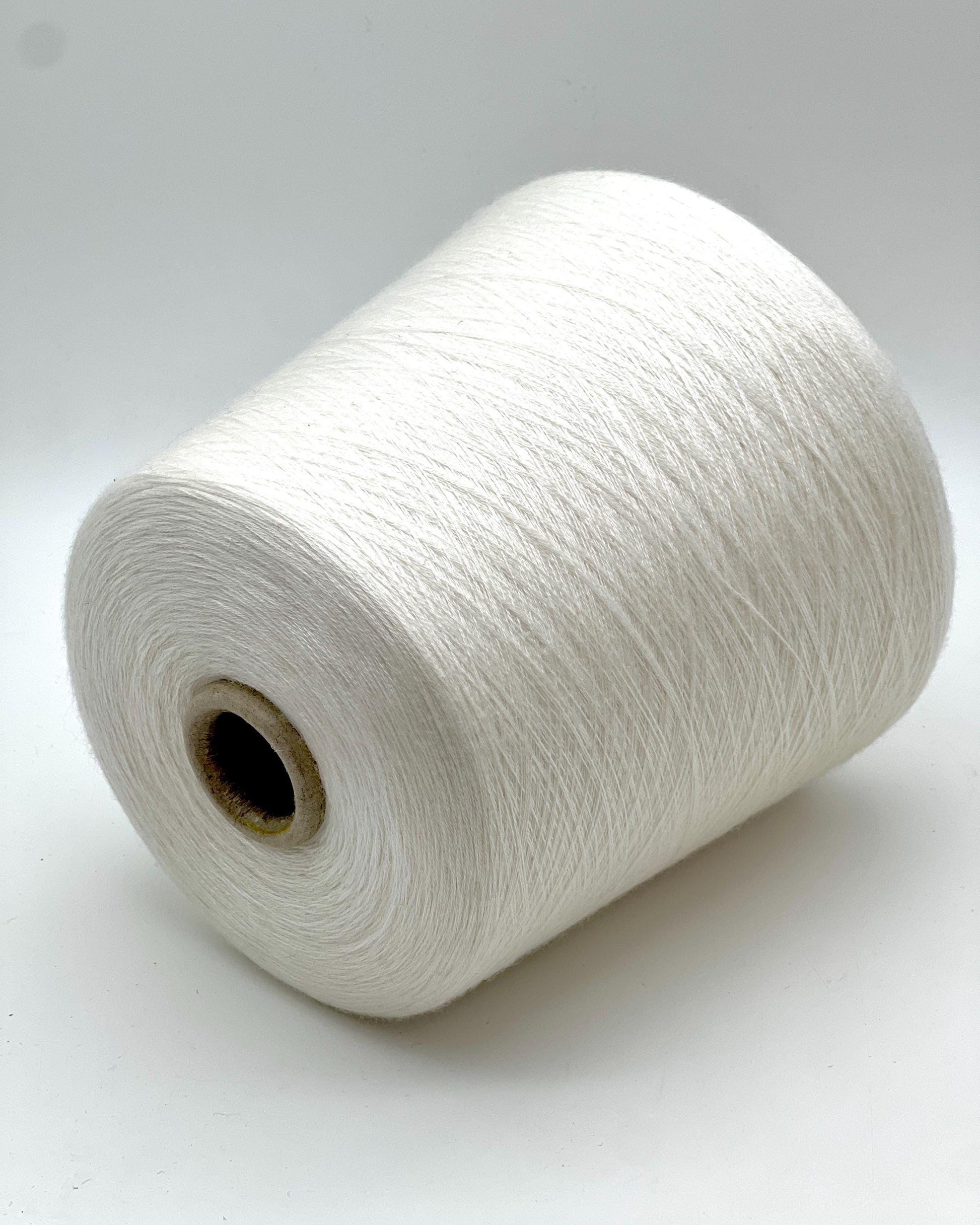 Ultra-fine 100% combed cashmere lace yarn SUPER CASHMERE by Loro Piana on cone, made in Italy. Rare luxury cashmere yarn with exceptional softness, strength, and elegant drape, curated by iDOKNiT for high-end knitting and weaving.