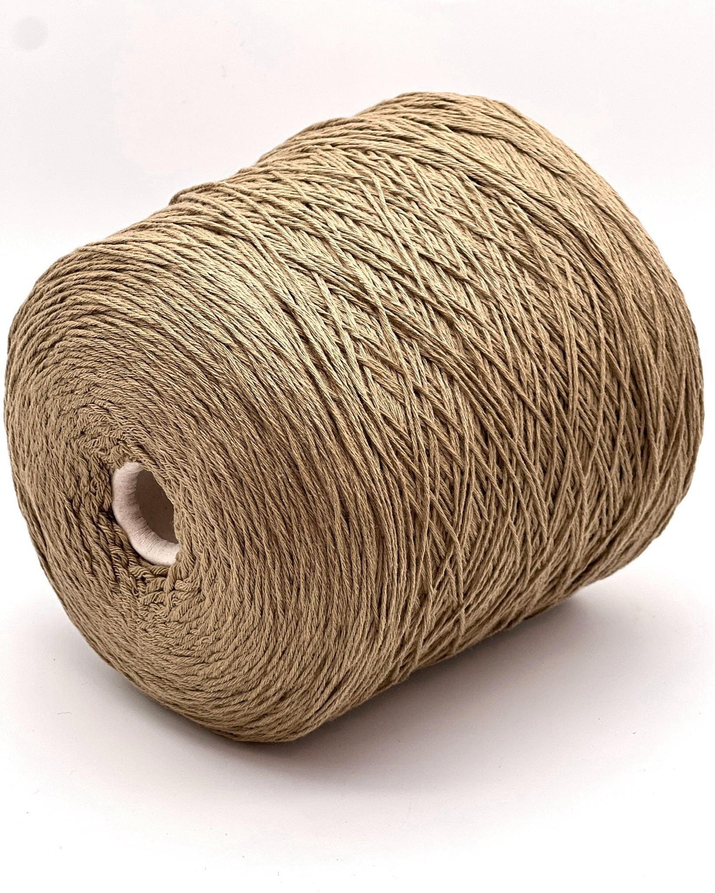 A curated collection of RiGo Supergeelong premium merino wool yarn in a palette of sophisticated neutrals and soft pinks. The image highlights the smooth, even texture and excellent stitch definition of this 100% Italian-made DK/Sport weight fiber. Authentic luxury yarn available at iDOKNiT.com.