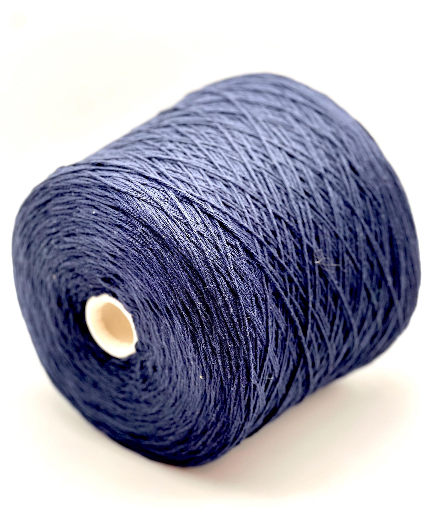 A curated collection of RiGo Supergeelong premium merino wool yarn in a palette of sophisticated neutrals and soft pinks. The image highlights the smooth, even texture and excellent stitch definition of this 100% Italian-made DK/Sport weight fiber. Authentic luxury yarn available at iDOKNiT.com.