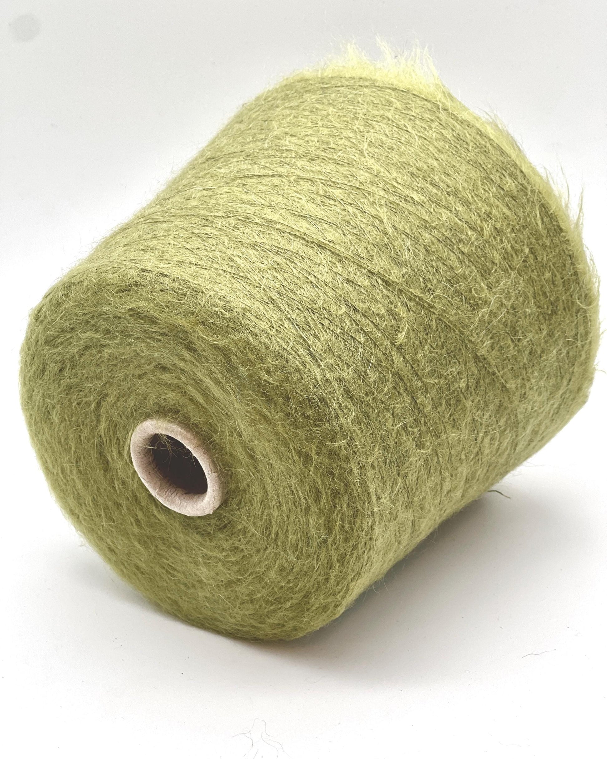 Green skein of yarn on a white background