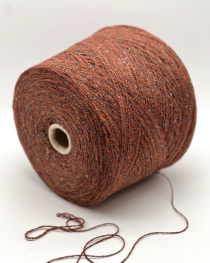 Brown yarn spool on a white background