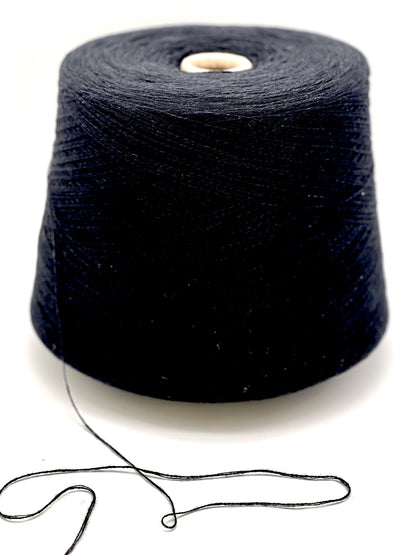 Spool of black yarn on a white background