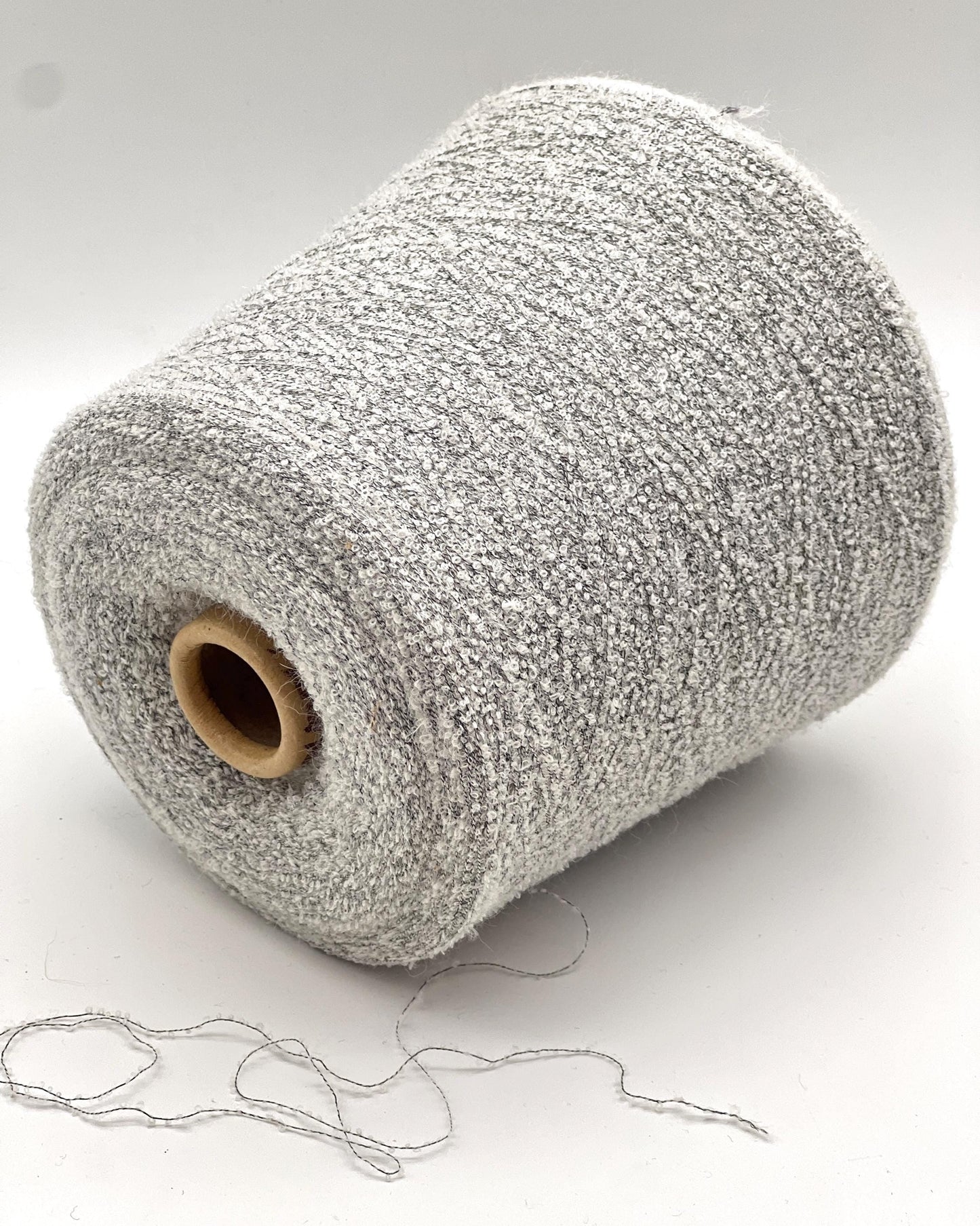 Elite iDOKNiT luxury micro-bouclé yarn, BABY15 by Polipeli Italy. 79% baby alpaca lace weight, Nm 14500. Authentic Italian-made fine airy loop yarn curated by iDOKNiT for professional knitting.