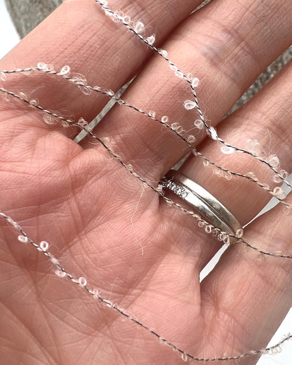 Elite iDOKNiT luxury micro-bouclé yarn, BABY15 by Polipeli Italy. 79% baby alpaca lace weight, Nm 14500. Authentic Italian-made fine airy loop yarn curated by iDOKNiT for professional knitting.