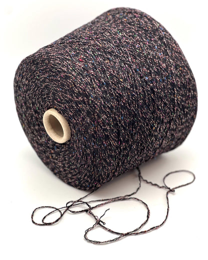 Spool of dark brown yarn on a white background