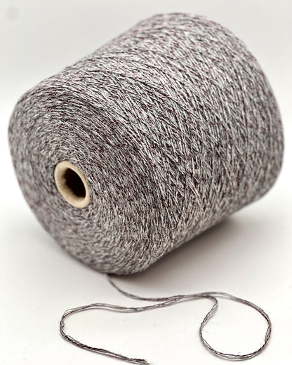 Spool of gray yarn on a white background