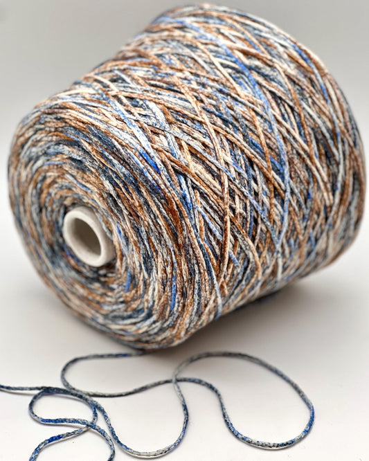 Spool of multicolored yarn on a white background