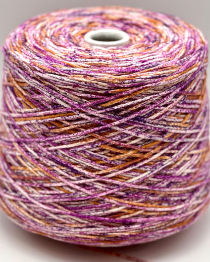 Spool of multicolored yarn on a white background