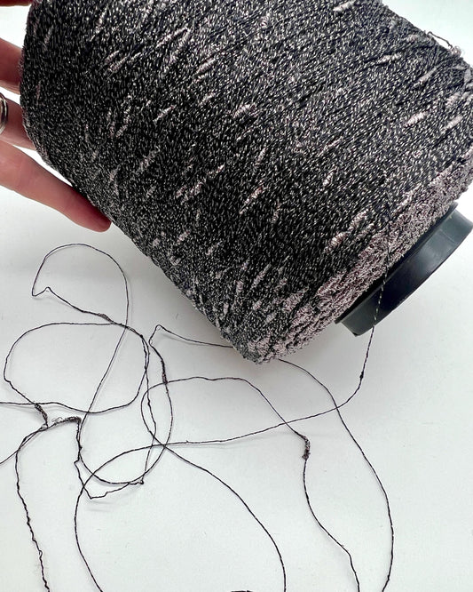 Person using a sponging tool on a white surface with black lines