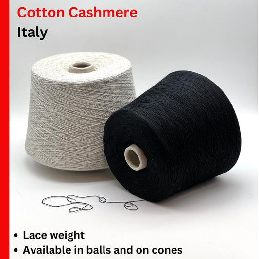 Two spools of yarn, one white and one black, on a white background with text about cotton cashmere from Italy.
