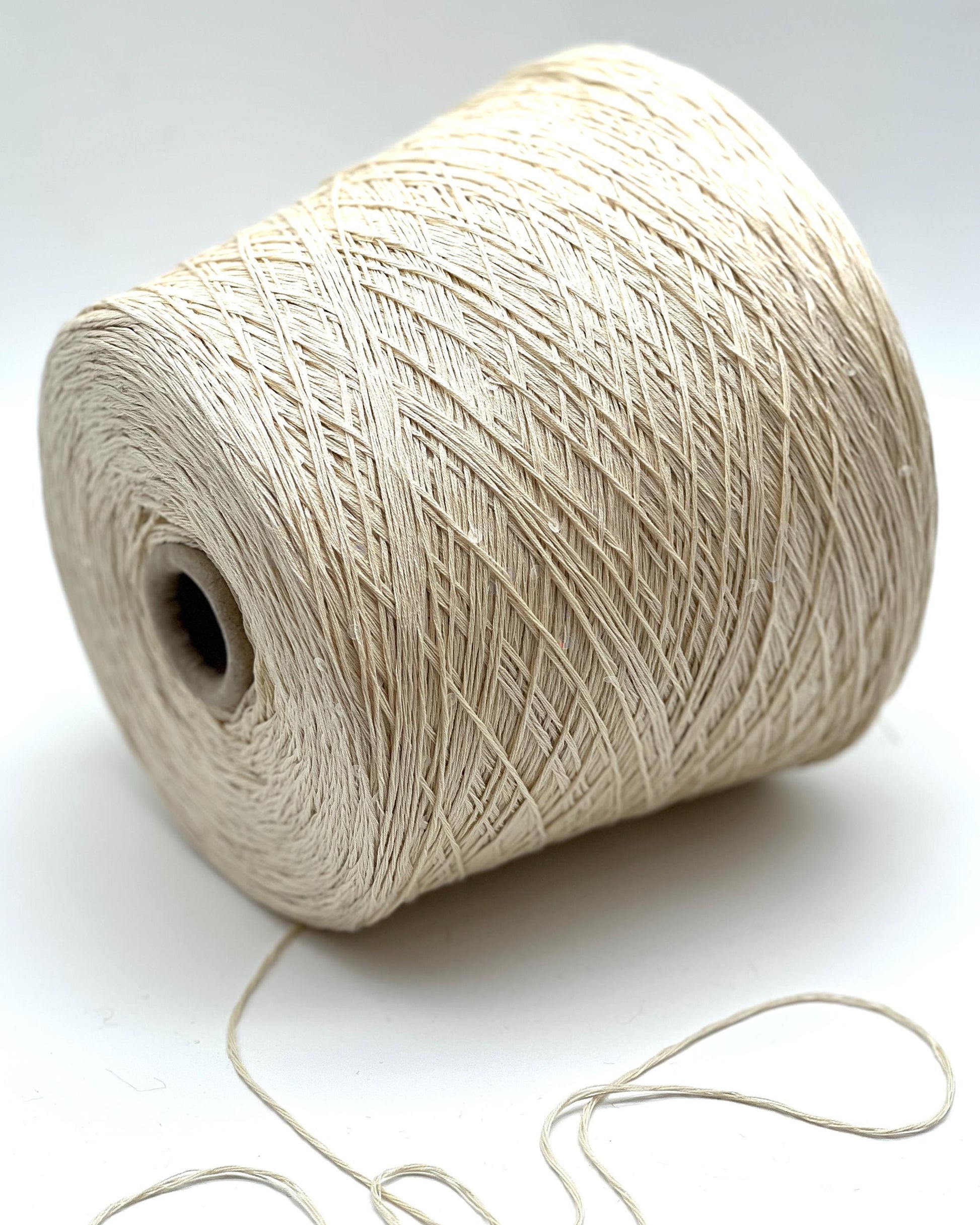 PAILLETTES Cotton yarn by Filati Naturali, Italy – 100% premium cotton with holographic 2mm sequins, ultra-soft and breathable with a sophisticated shimmer. Ideal for summer tops, evening shawls, and luxury knitwear. Premium Italian yarn available at iDOKNiT.com.