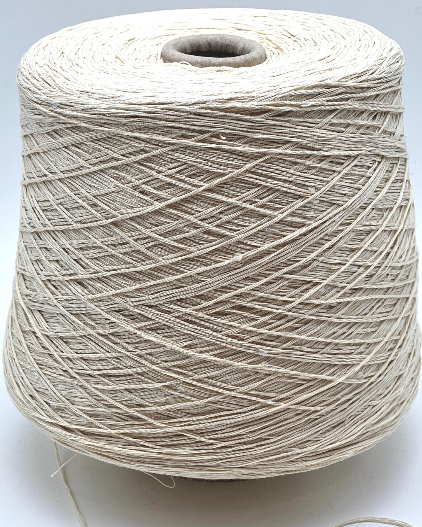 PAILLETTES Cotton yarn by Filati Naturali, Italy – 100% premium cotton with holographic 2mm sequins, ultra-soft and breathable with a sophisticated shimmer. Ideal for summer tops, evening shawls, and luxury knitwear. Premium Italian yarn available at iDOKNiT.com.