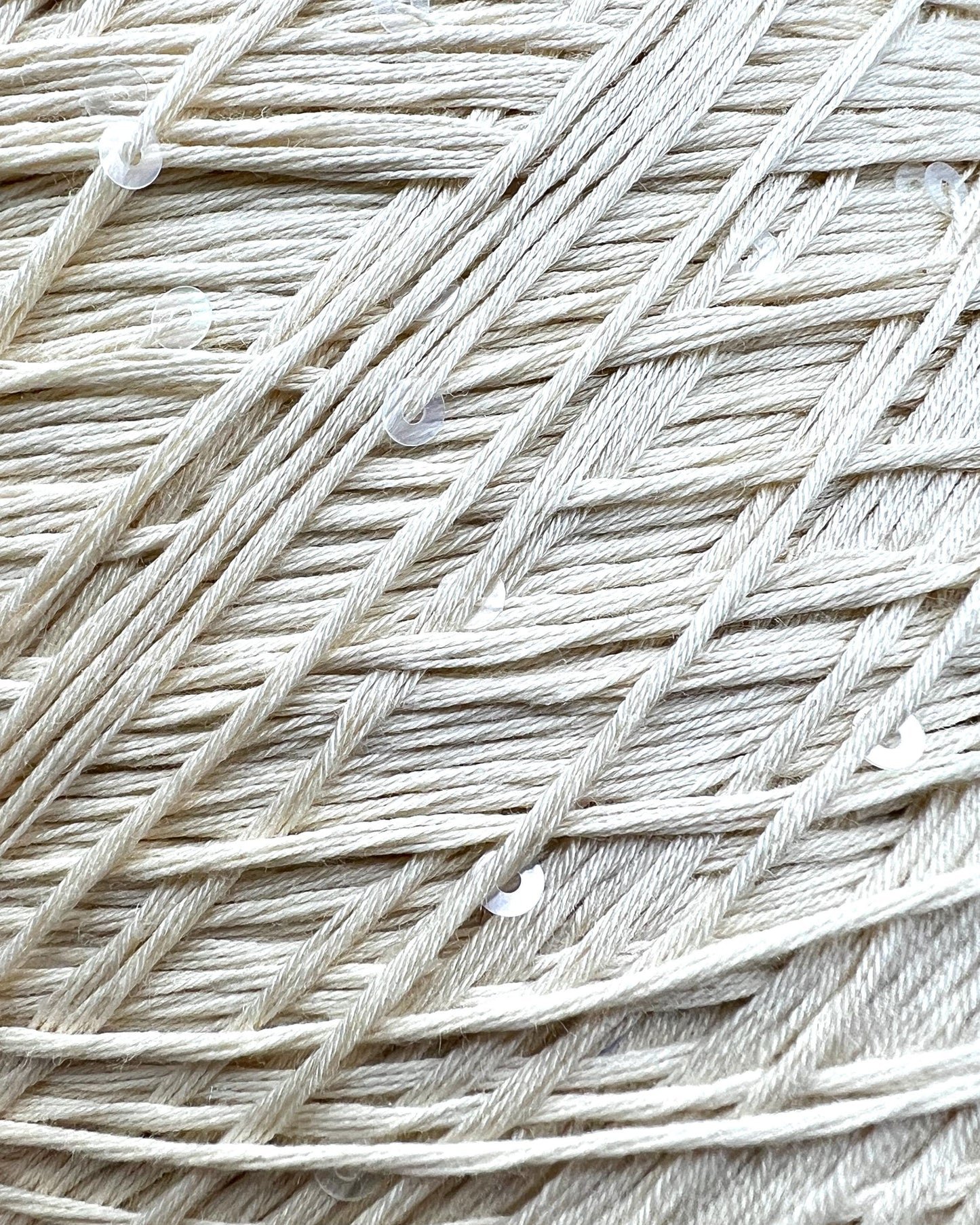 PAILLETTES Cotton yarn by Filati Naturali, Italy – 100% premium cotton with holographic 2mm sequins, ultra-soft and breathable with a sophisticated shimmer. Ideal for summer tops, evening shawls, and luxury knitwear. Premium Italian yarn available at iDOKNiT.com.