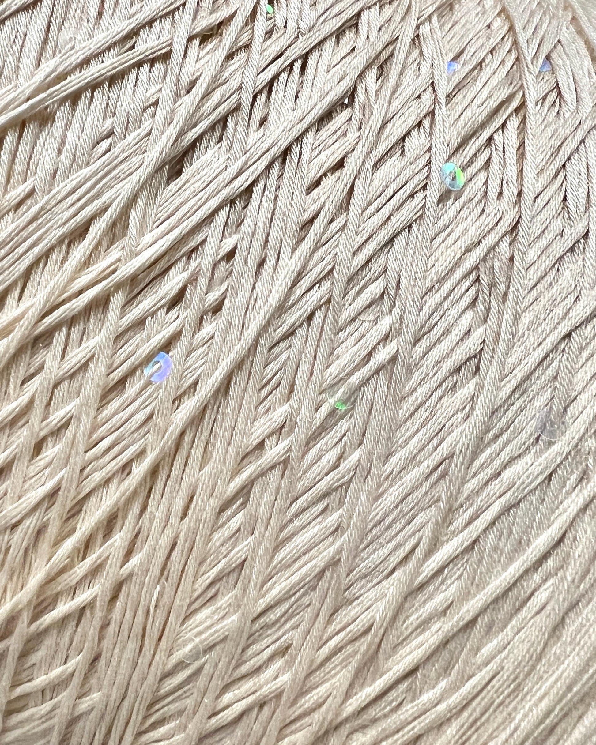 PAILLETTES Cotton yarn by Filati Naturali, Italy – 100% premium cotton with holographic 2mm sequins, ultra-soft and breathable with a sophisticated shimmer. Ideal for summer tops, evening shawls, and luxury knitwear. Premium Italian yarn available at iDOKNiT.com.