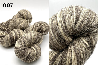 Exclusive iDOKNiT rustic fingering weight yarn, Romanov Sheep Wool from Paces Vilnas Fabrika, Latvia. 100% pure Romanov wool traditionally processed to retain 70% natural lanolin for extreme durability and weather resistance. Single-ply construction providing 420m per 100g. Curated by iDOKNiT in natural and tweed-effect dyed shades for heritage-style, hearty knitwear.