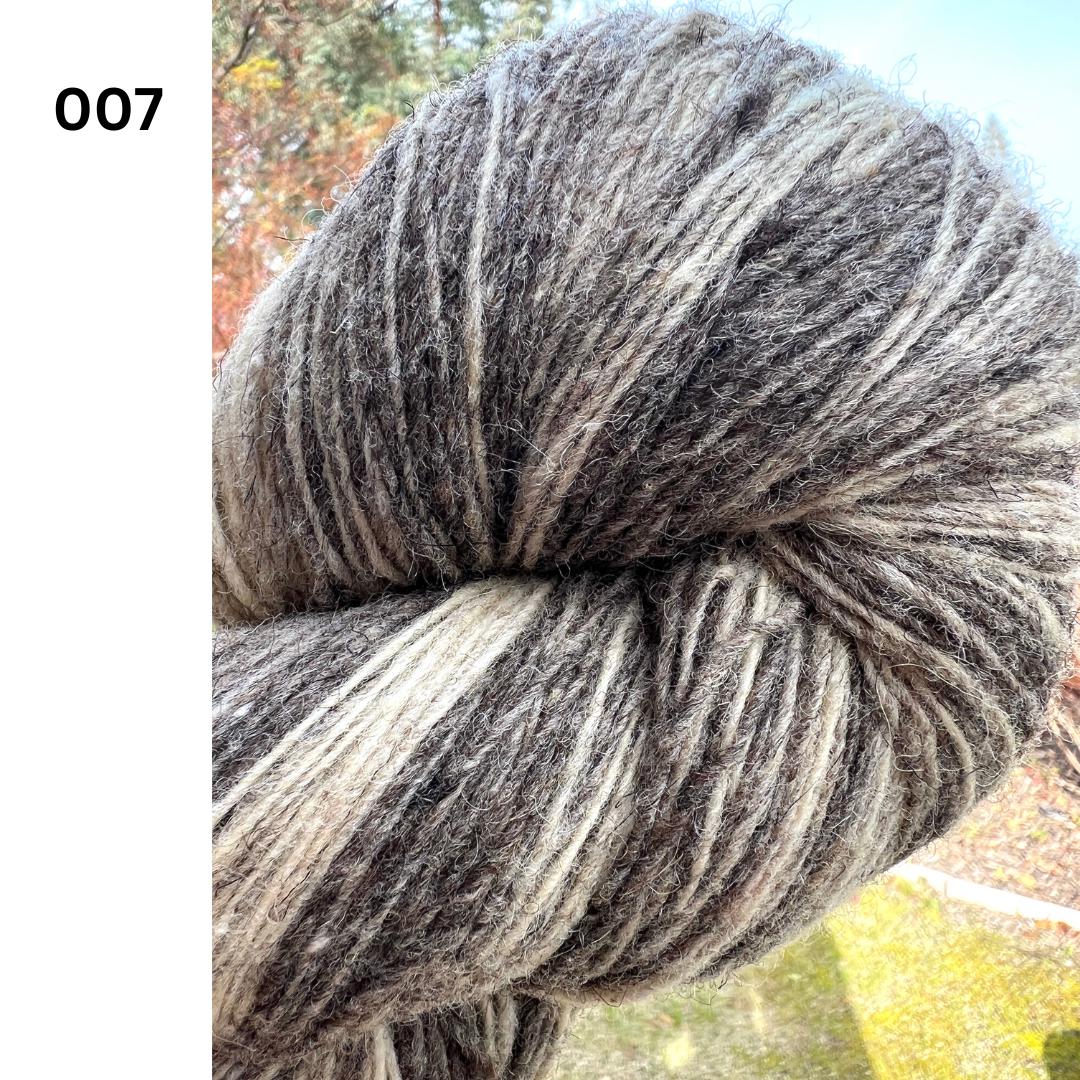 Exclusive iDOKNiT rustic fingering weight yarn, Romanov Sheep Wool from Paces Vilnas Fabrika, Latvia. 100% pure Romanov wool traditionally processed to retain 70% natural lanolin for extreme durability and weather resistance. Single-ply construction providing 420m per 100g. Curated by iDOKNiT in natural and tweed-effect dyed shades for heritage-style, hearty knitwear.