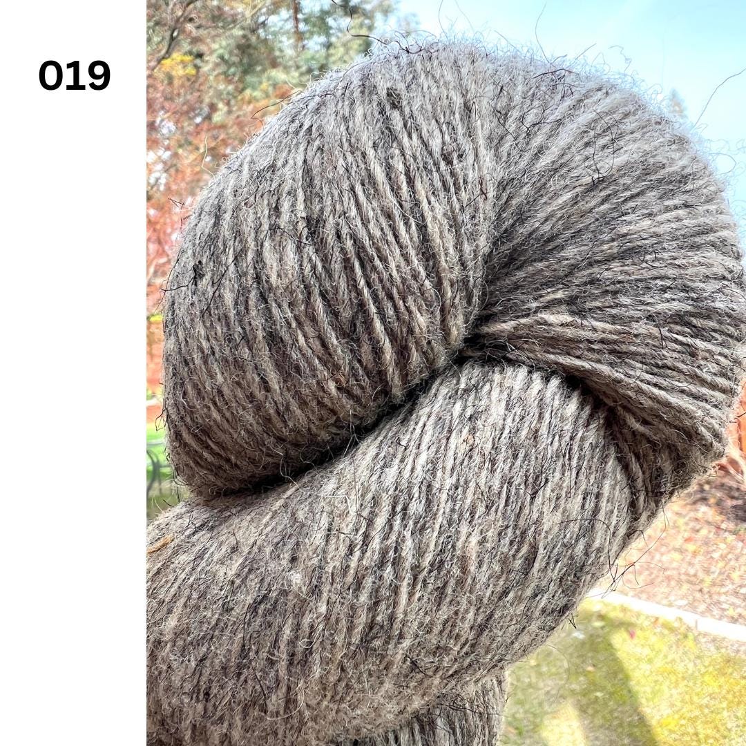 Exclusive iDOKNiT rustic fingering weight yarn, Romanov Sheep Wool from Paces Vilnas Fabrika, Latvia. 100% pure Romanov wool traditionally processed to retain 70% natural lanolin for extreme durability and weather resistance. Single-ply construction providing 420m per 100g. Curated by iDOKNiT in natural and tweed-effect dyed shades for heritage-style, hearty knitwear.