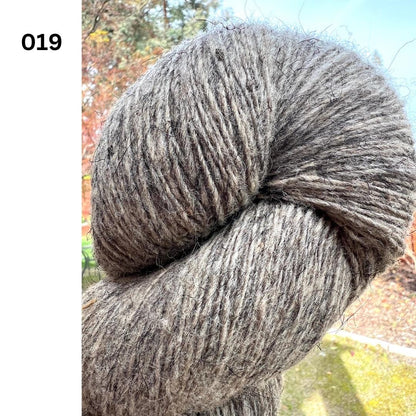 Exclusive iDOKNiT rustic fingering weight yarn, Romanov Sheep Wool from Paces Vilnas Fabrika, Latvia. 100% pure Romanov wool traditionally processed to retain 70% natural lanolin for extreme durability and weather resistance. Single-ply construction providing 420m per 100g. Curated by iDOKNiT in natural and tweed-effect dyed shades for heritage-style, hearty knitwear.
