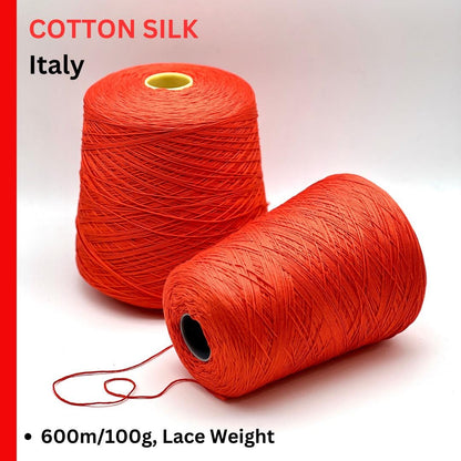 Luxury COTTON SILK lace-weight yarn by Botto Giuseppe, Italy – 55% silk and 45% cotton blend, super soft with an elegant natural sheen. Shown in vibrant coral red on a cone. Ideal for summer tops, lightweight layering, and luxury blending. Premium Italian yarn available at iDOKNiT.com.