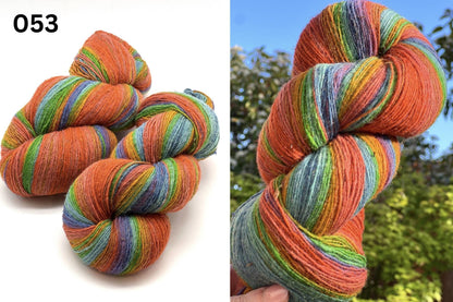 Small-batch dyed heritage skeins of 100% Latvian Dark-Headed Sheep Wool in earthy multicolor gradients like Green-Brown #052. The image shows the rustic single-ply texture and the sheep breed origin, representing the authentic wool traditions of Paces Vilnas Fabrika, Latvia. Available at iDOKNiT.com.