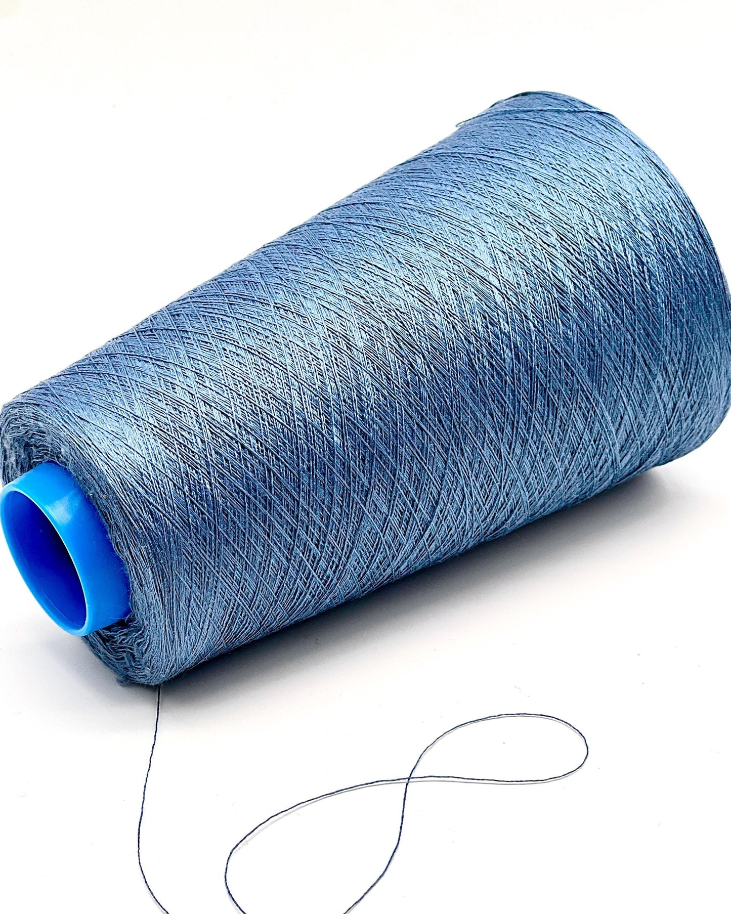 Botto Giuseppe Shine 100% pure Mulberry silk extra-fine lace weight yarn from iDOKNiT. Premium sustainable Italian-spun fiber with high natural luster for luxury knitting and weaving, 3000m per 100g cone.