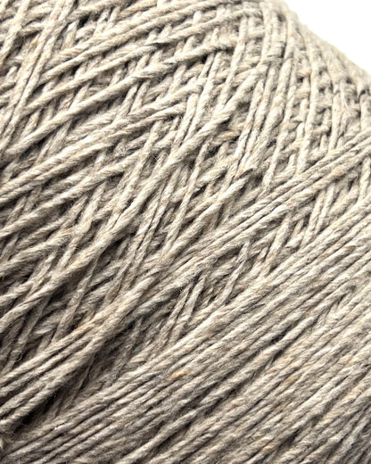 Exclusive iDOKNiT DK weight cashmere yarn, Cashmere Donegal by Cariaggi Italy. 100% pure cashmere featuring a sophisticated Donegal tweed texture, Nm 2.000, providing 200m per 100g. Authentic Italian-made luxury fiber in 1540 Stone Beige Melange, curated by iDOKNiT for exceptionally soft, high-end sweaters and winter accessories.