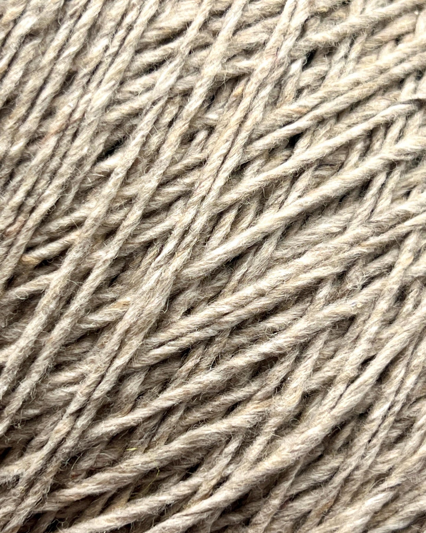 Exclusive iDOKNiT DK weight cashmere yarn, Cashmere Donegal by Cariaggi Italy. 100% pure cashmere featuring a sophisticated Donegal tweed texture, Nm 2.000, providing 200m per 100g. Authentic Italian-made luxury fiber in 1540 Stone Beige Melange, curated by iDOKNiT for exceptionally soft, high-end sweaters and winter accessories.