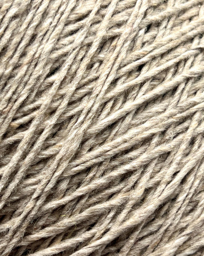 Exclusive iDOKNiT DK weight cashmere yarn, Cashmere Donegal by Cariaggi Italy. 100% pure cashmere featuring a sophisticated Donegal tweed texture, Nm 2.000, providing 200m per 100g. Authentic Italian-made luxury fiber in 1540 Stone Beige Melange, curated by iDOKNiT for exceptionally soft, high-end sweaters and winter accessories.
