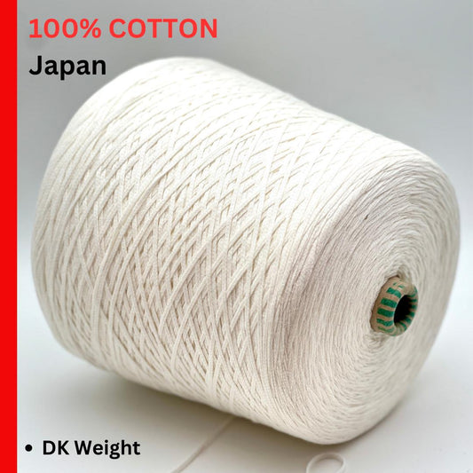 Spool of white cotton yarn with '100% Cotton Japan' text on a gray background