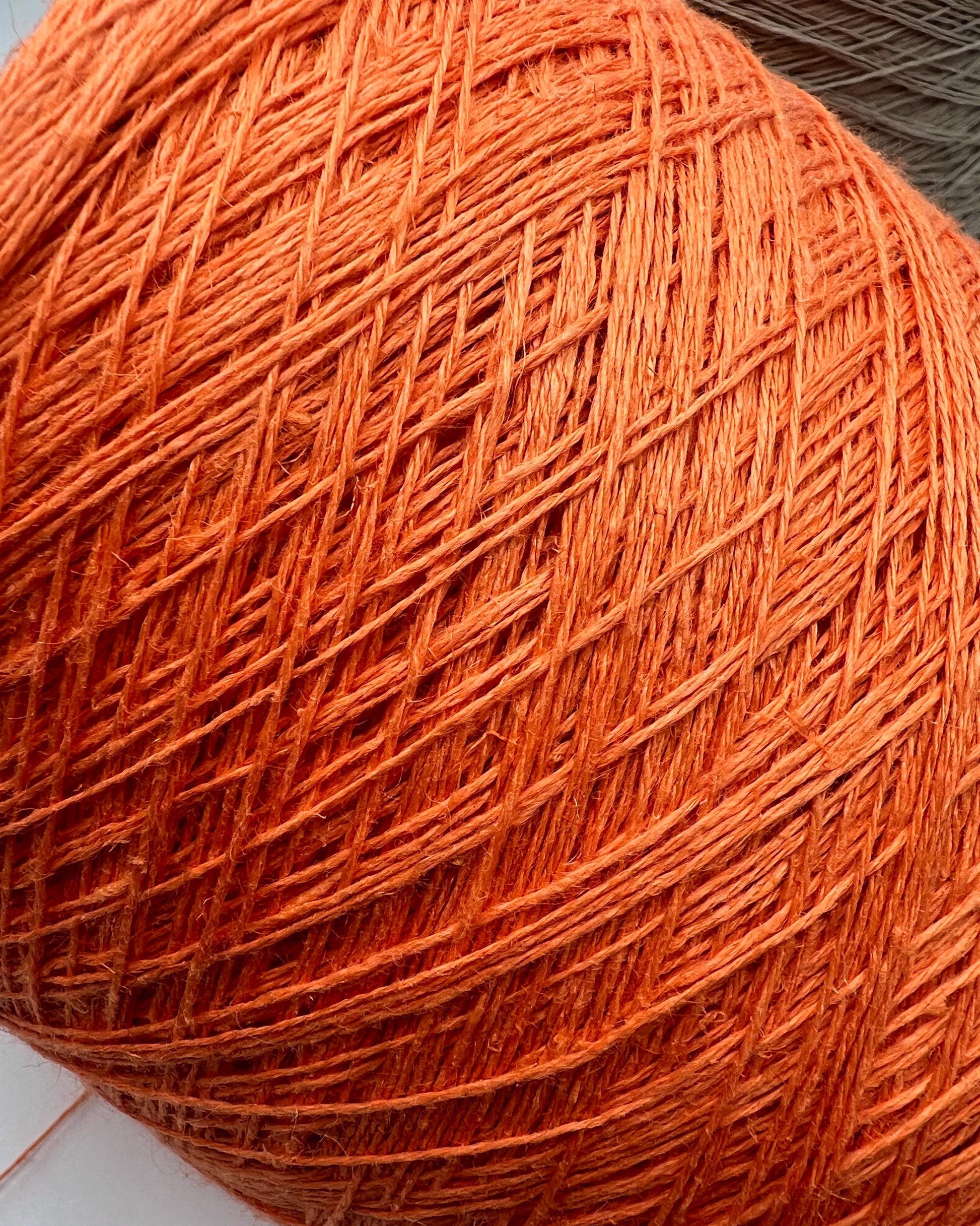 Premium iDOKNiT fingering weight yarn, FRESCOLINO by RiGo Italy. 100% pure linen fiber with an Nm 3/12 count, providing 400m per 100g. Authentic Italian-made plant fiber curated by iDOKNiT for breathable, long-lasting summer garments in vibrant shades like 1488 Orange and 1489 Beige.