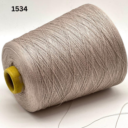 Emilcotoni Silk & Cotton lace yarn from Italy. Shown on professional cones in shades like Ochre, Navy Blue, and Brown. High-quality designer yarn for retail at iDOKNiT.com.