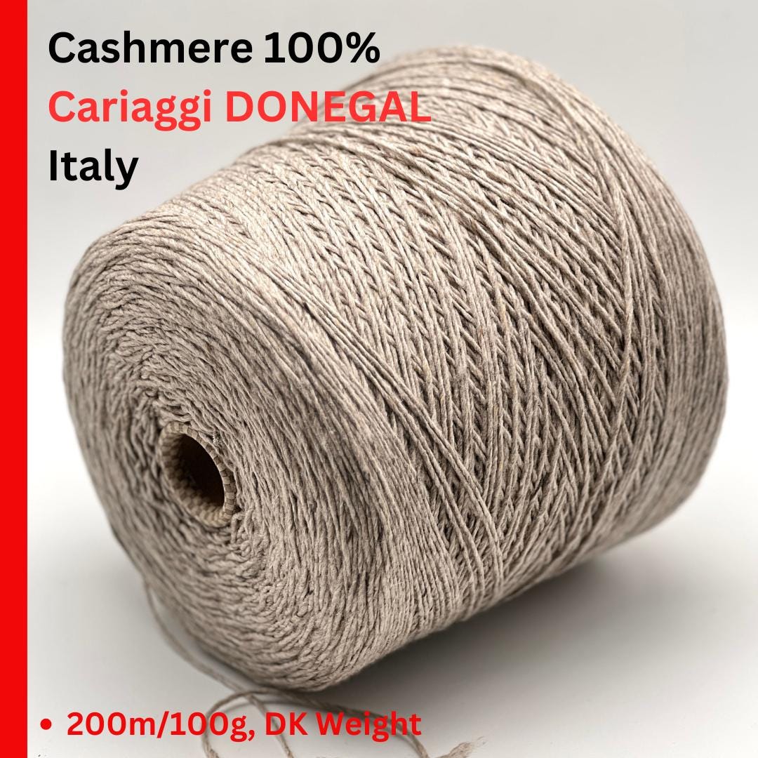 Exclusive iDOKNiT DK weight cashmere yarn, Cashmere Donegal by Cariaggi Italy. 100% pure cashmere featuring a sophisticated Donegal tweed texture, Nm 2.000, providing 200m per 100g. Authentic Italian-made luxury fiber in 1540 Stone Beige Melange, curated by iDOKNiT for exceptionally soft, high-end sweaters and winter accessories.