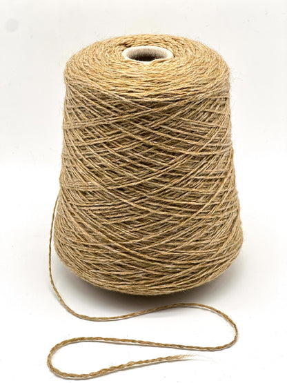 Spool of brown thread on a white background