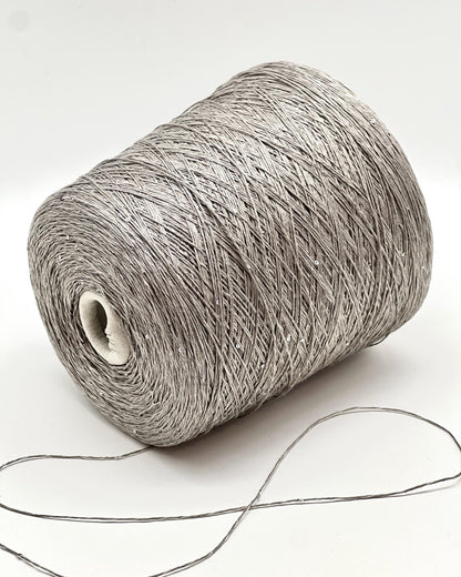SAINT TROPEZ luxury yarn by RiGo, Italy – fingering weight blend of 80% linen, 15% silk, and 5% silver paillettes. Light, breathable, with a luminous sparkle. Ideal for elegant warm-weather knits. 1564 silver color.