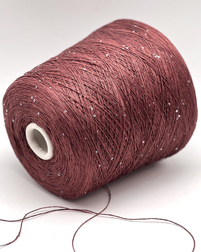 SAINT TROPEZ luxury yarn by RiGo, Italy – fingering weight blend of 80% linen, 15% silk, and 5% silver paillettes. Light, breathable, with a luminous sparkle. Ideal for elegant warm-weather knits. Brick color.