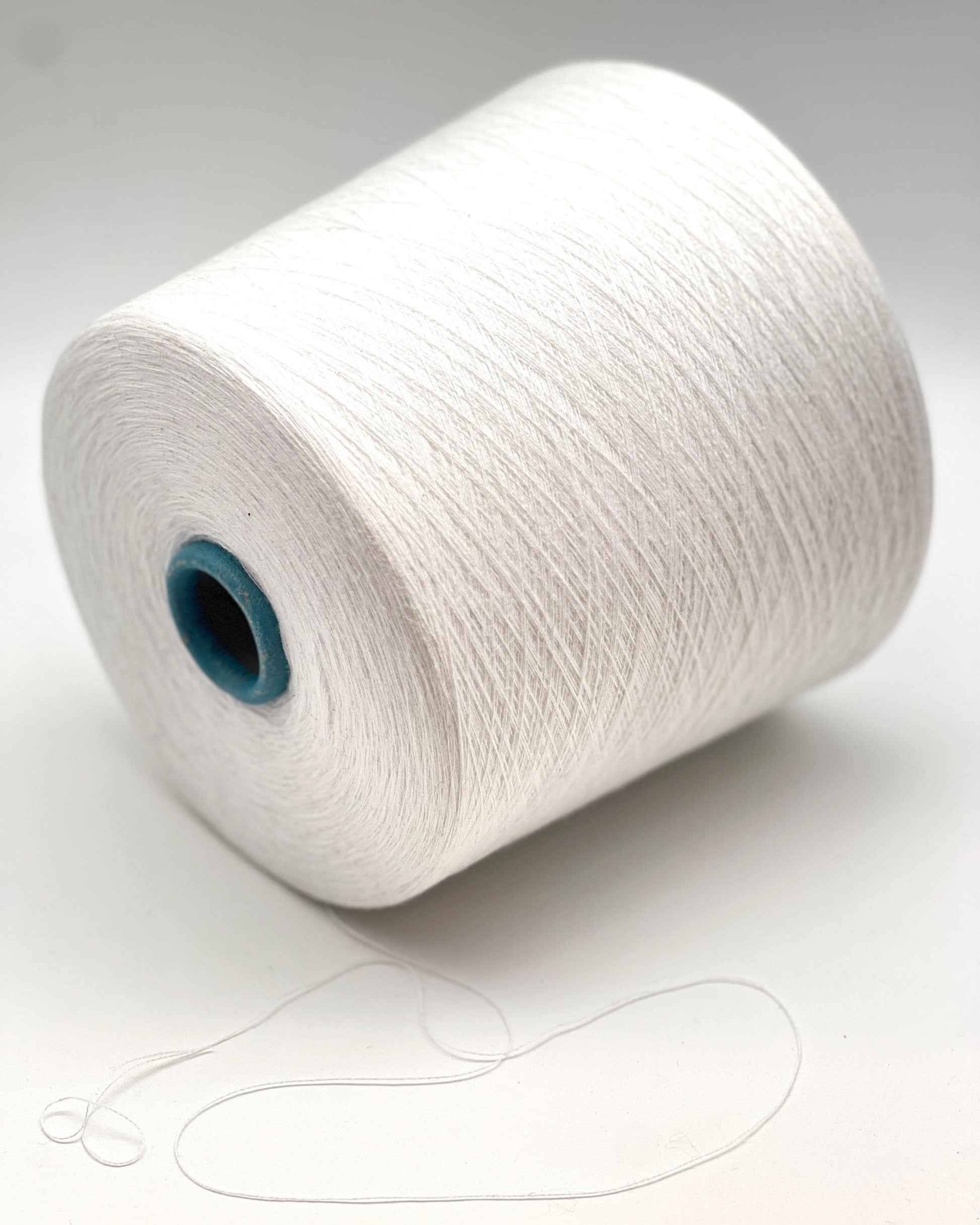 White spool of yarn on a white background