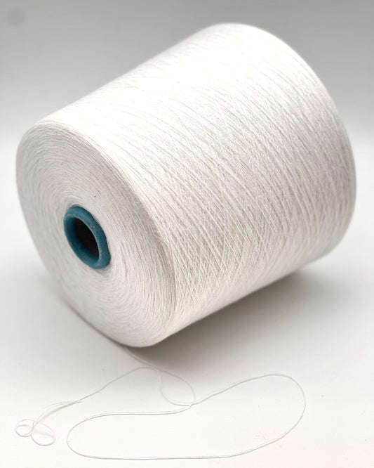 White spool of yarn on a white background