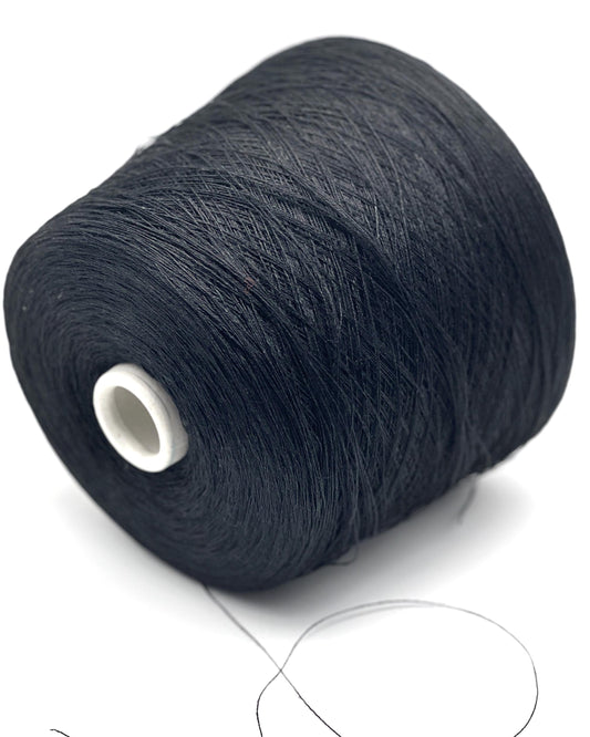 Spool of dark blue yarn on a white background
