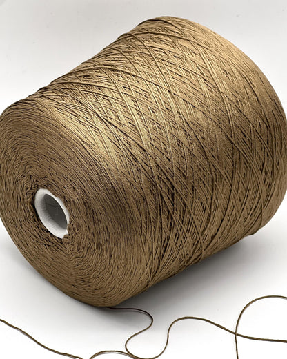 Large spool of brown thread on a white background