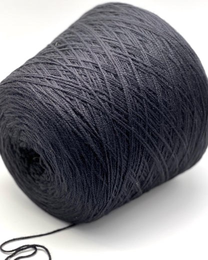 Large ball of dark gray yarn on a white background