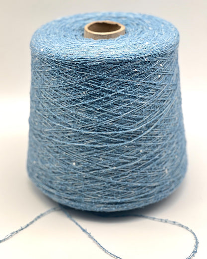 Spool of blue yarn on a white background