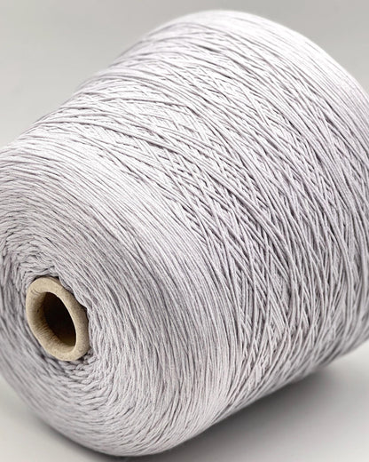 Spool of gray yarn on a light gray background