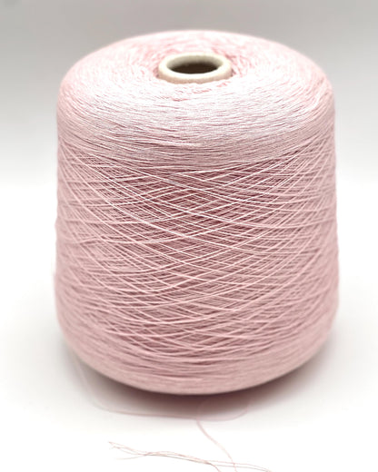 Pink spool of yarn on a white background