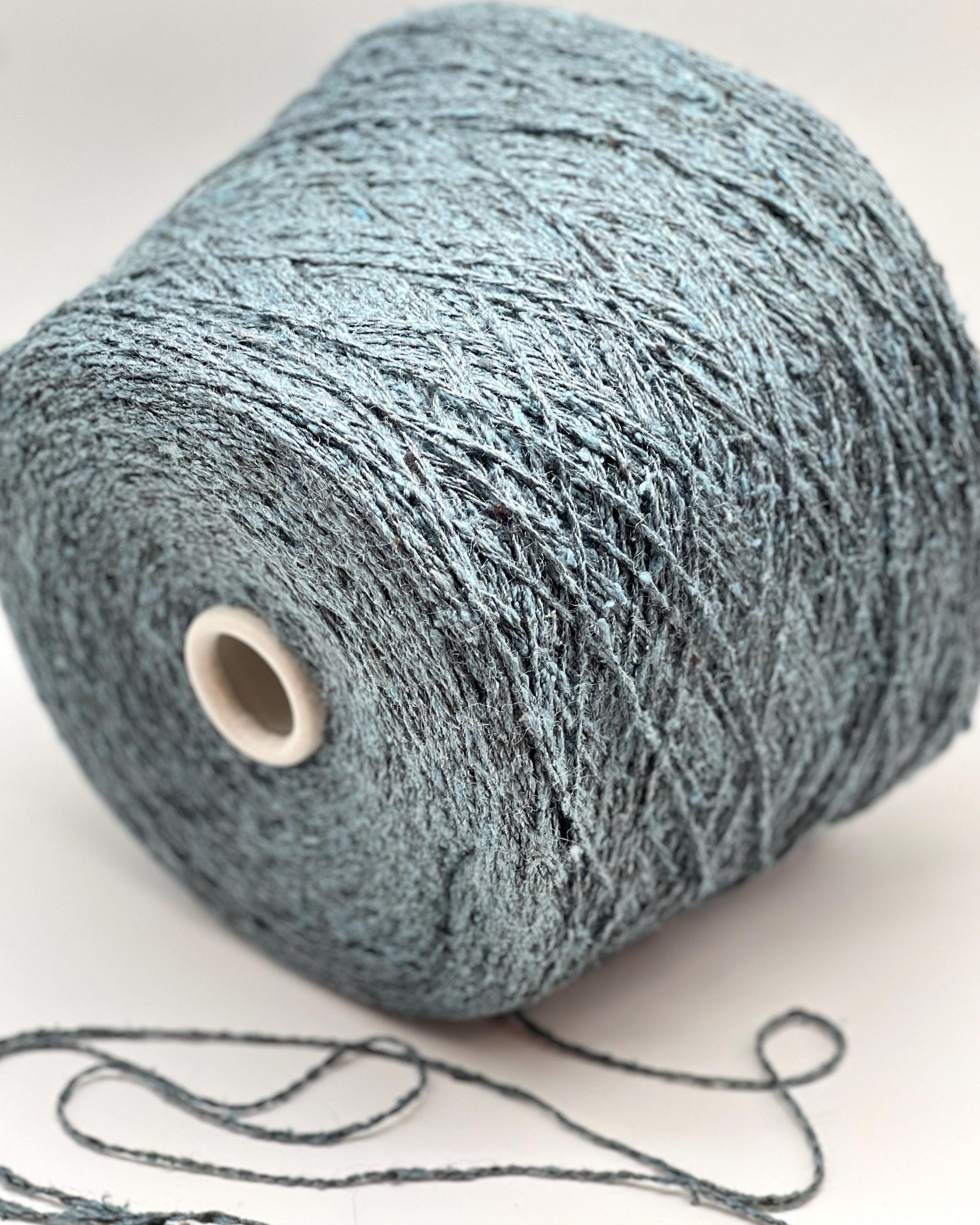 Large skein of gray yarn on a white background