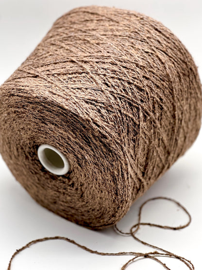 Brown spool of yarn on a white background